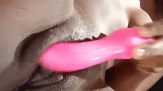 Fucking her coochie with a toy!